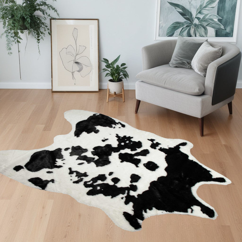 4' X 5' Faux Cow Hide Brown And White Area Rug