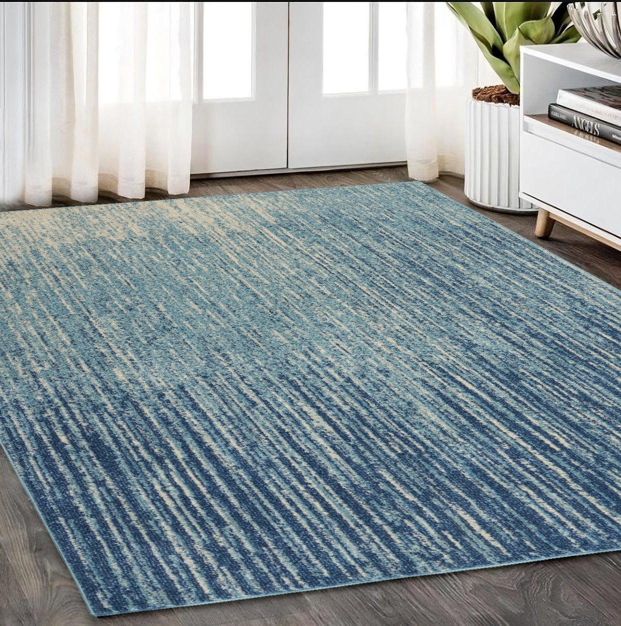 7' X 10' Blue and Ivory Abstract Stripes Power Loom Area Rug