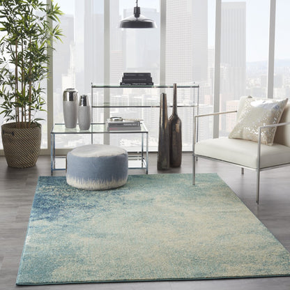 5' X 7' Ivory And Blue Abstract Power Loom Area Rug