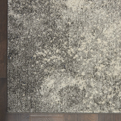 5' X 7' Gray And Ivory Abstract Power Loom Area Rug