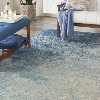 5' X 7' Ivory And Blue Abstract Power Loom Area Rug