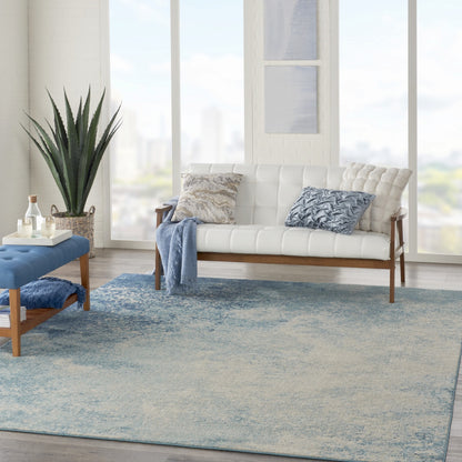 5' X 7' Ivory And Blue Abstract Power Loom Area Rug