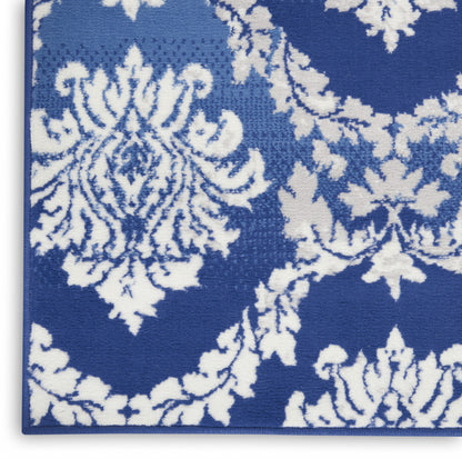 6' X 9' Blue And Ivory Floral Dhurrie Area Rug