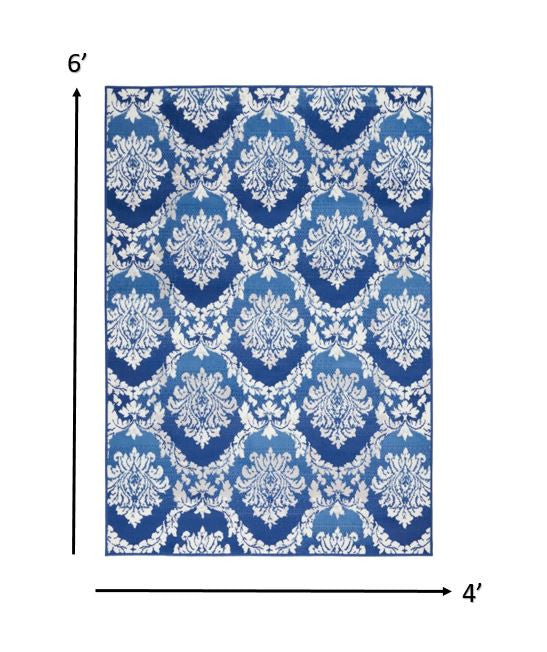 6' X 9' Blue And Ivory Floral Dhurrie Area Rug