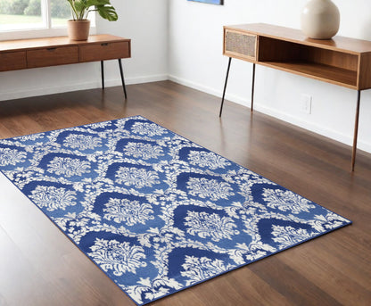 6' X 9' Blue And Ivory Floral Dhurrie Area Rug