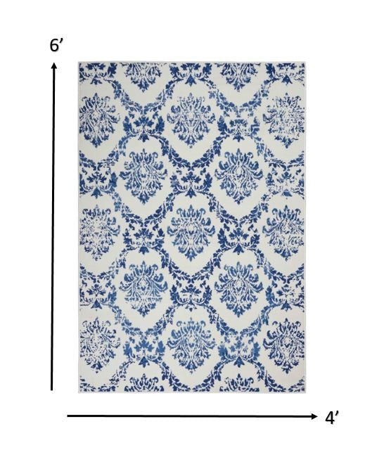 6' X 9' Blue And Ivory Floral Dhurrie Area Rug