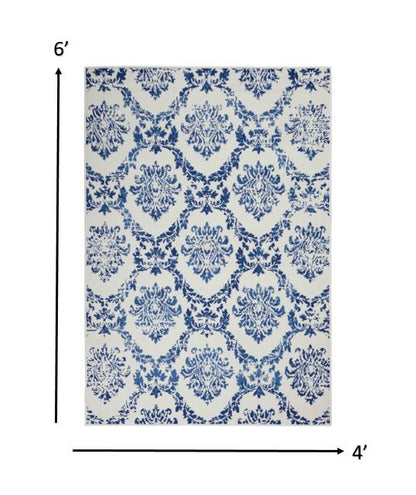 6' X 9' Blue And Ivory Floral Dhurrie Area Rug