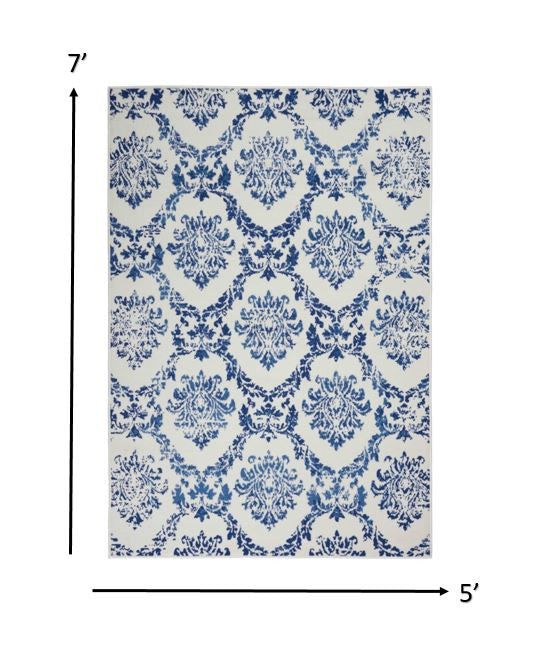 6' X 9' Blue And Ivory Floral Dhurrie Area Rug