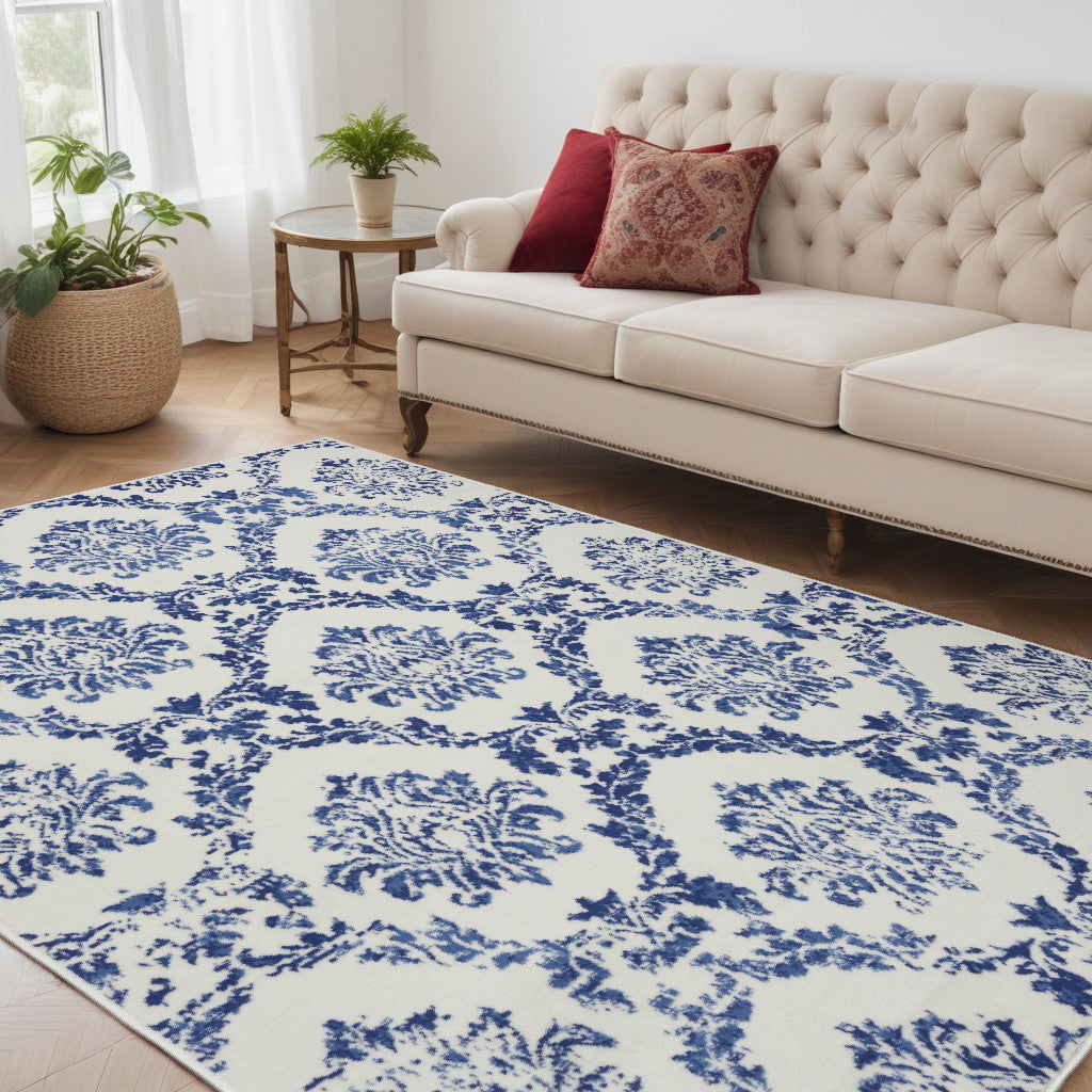 6' X 9' Blue And Ivory Floral Dhurrie Area Rug