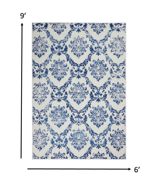 6' X 9' Blue And Ivory Floral Dhurrie Area Rug