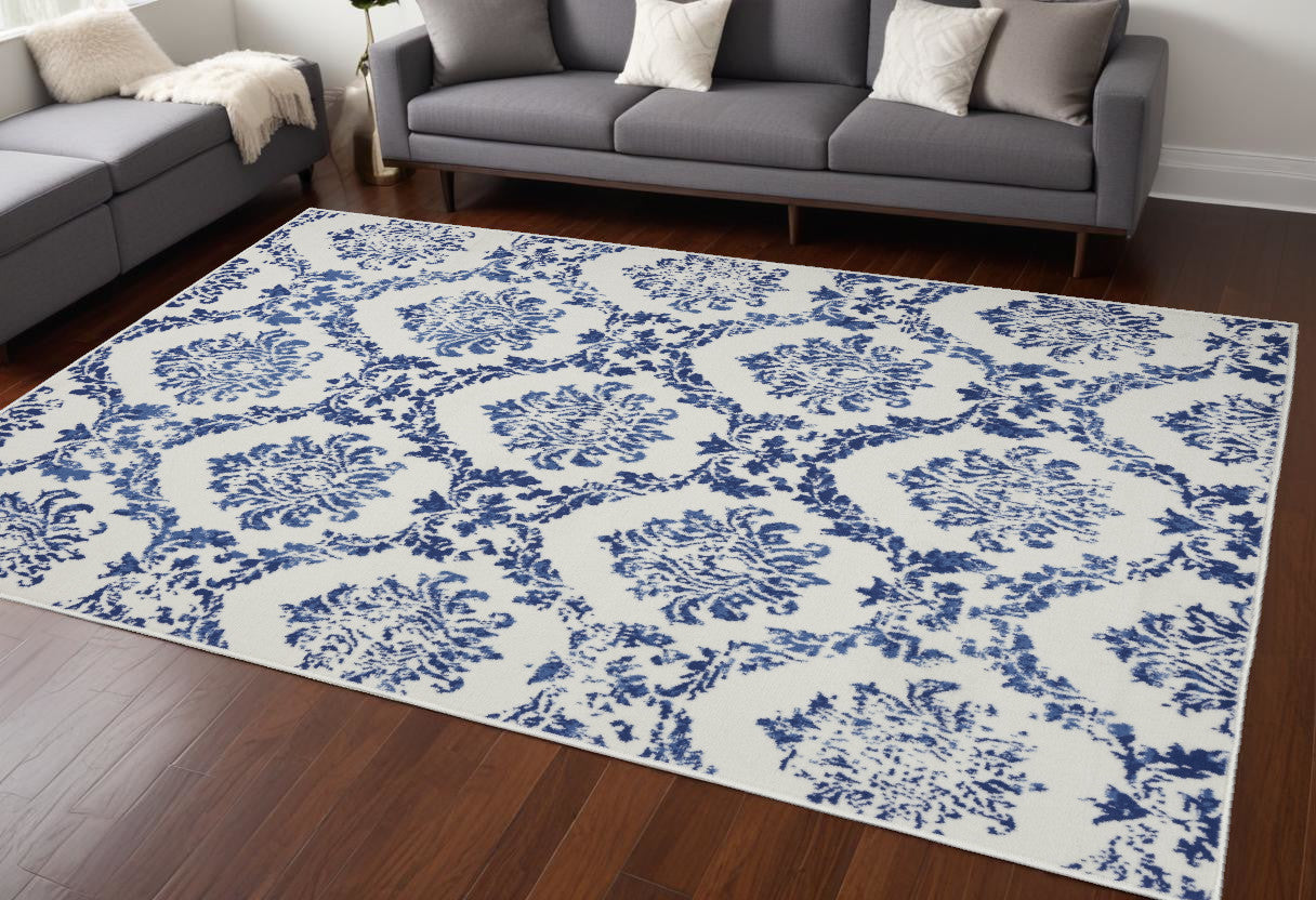 6' X 9' Blue And Ivory Floral Dhurrie Area Rug