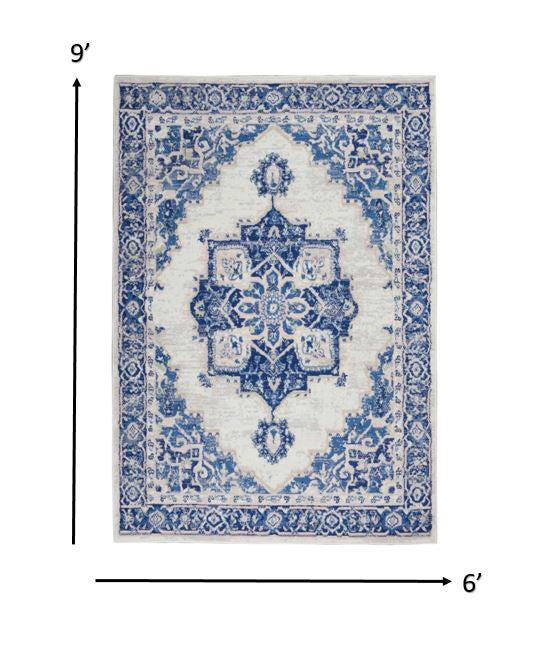 4' X 6' Blue And Ivory Floral Dhurrie Area Rug