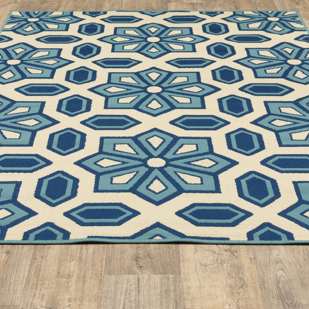 8' x 11' Ivory and Blue Geometric Stain Resistant Indoor Outdoor Area Rug