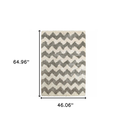 4' X 6' Grey And Ivory Geometric Shag Power Loom Stain Resistant Area Rug