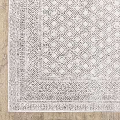 6' X 9' White And Grey Oriental Power Loom Stain Resistant Area Rug