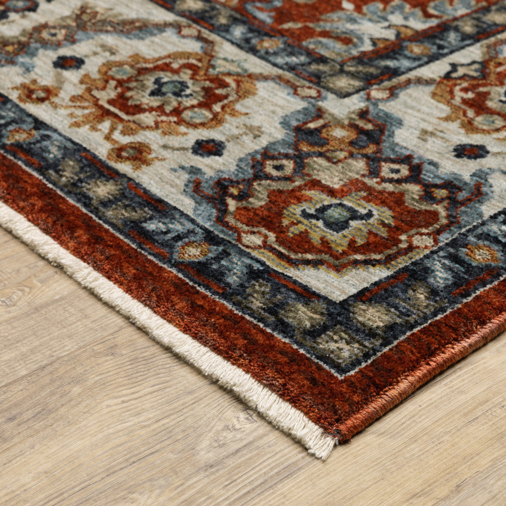 10' X 13' Red Blue Ivory Gold And Navy Oriental Power Loom Stain Resistant Area Rug With Fringe