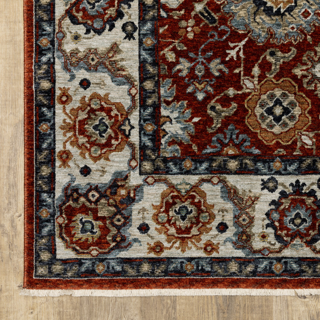 10' X 13' Red Blue Ivory Gold And Navy Oriental Power Loom Stain Resistant Area Rug With Fringe