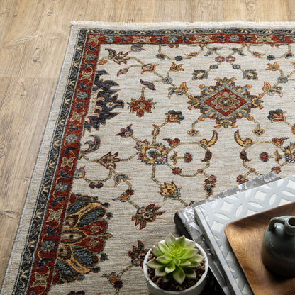 10' X 13' Beige Rust Red Blue Gold And Grey Oriental Power Loom Stain Resistant Area Rug With Fringe