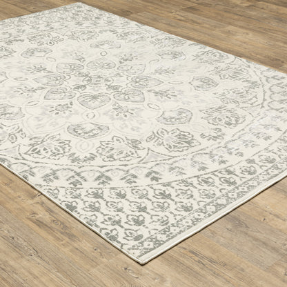 10' X 13' Ivory And Grey Floral Power Loom Stain Resistant Area Rug