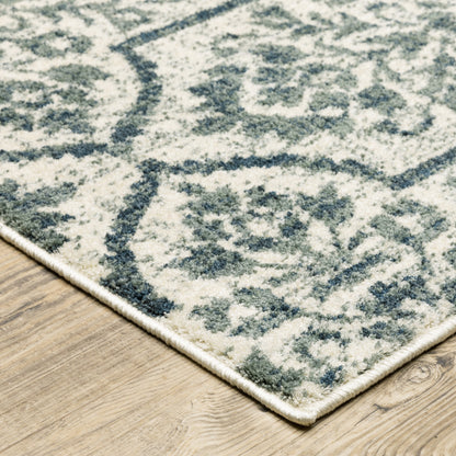 10' X 13' Ivory Blue And Sage Floral Power Loom Stain Resistant Area Rug