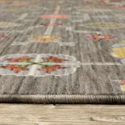 10' X 13' Grey Charcoal Yellow Blue Rust Red Pink Green And Ivory Oriental Power Loom Stain Resistant Area Rug With Fringe