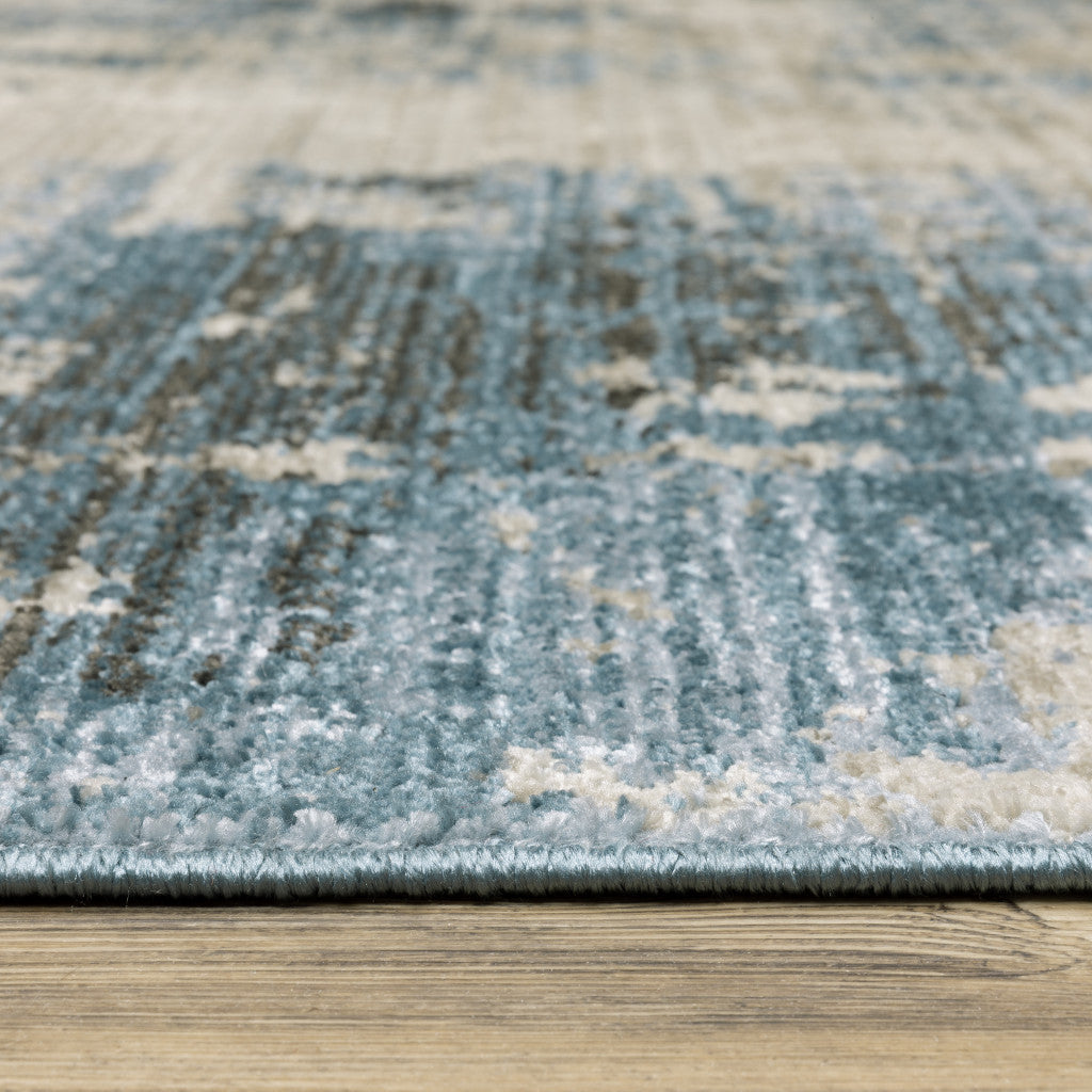 10' X 13' Blue Grey Ivory Light Blue And Dark Blue Abstract Power Loom Stain Resistant Area Rug With Fringe