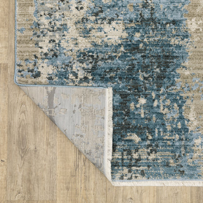 10' X 13' Blue Grey Ivory Light Blue And Dark Blue Abstract Power Loom Stain Resistant Area Rug With Fringe