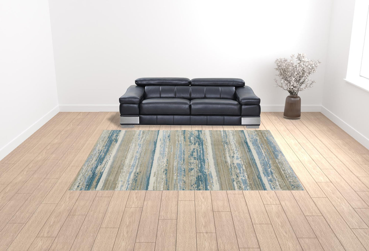 10' X 13' Ivory Beige Grey Blue And Tan Abstract Power Loom Stain Resistant Area Rug With Fringe