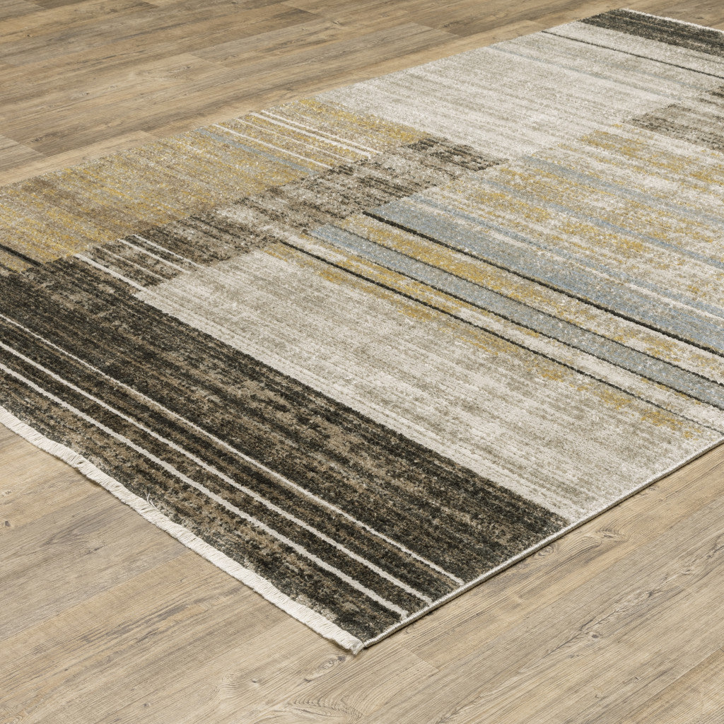 10' X 13' Beige Charcoal Brown Grey Tan Gold And Blue Geometric Power Loom Stain Resistant Area Rug With Fringe