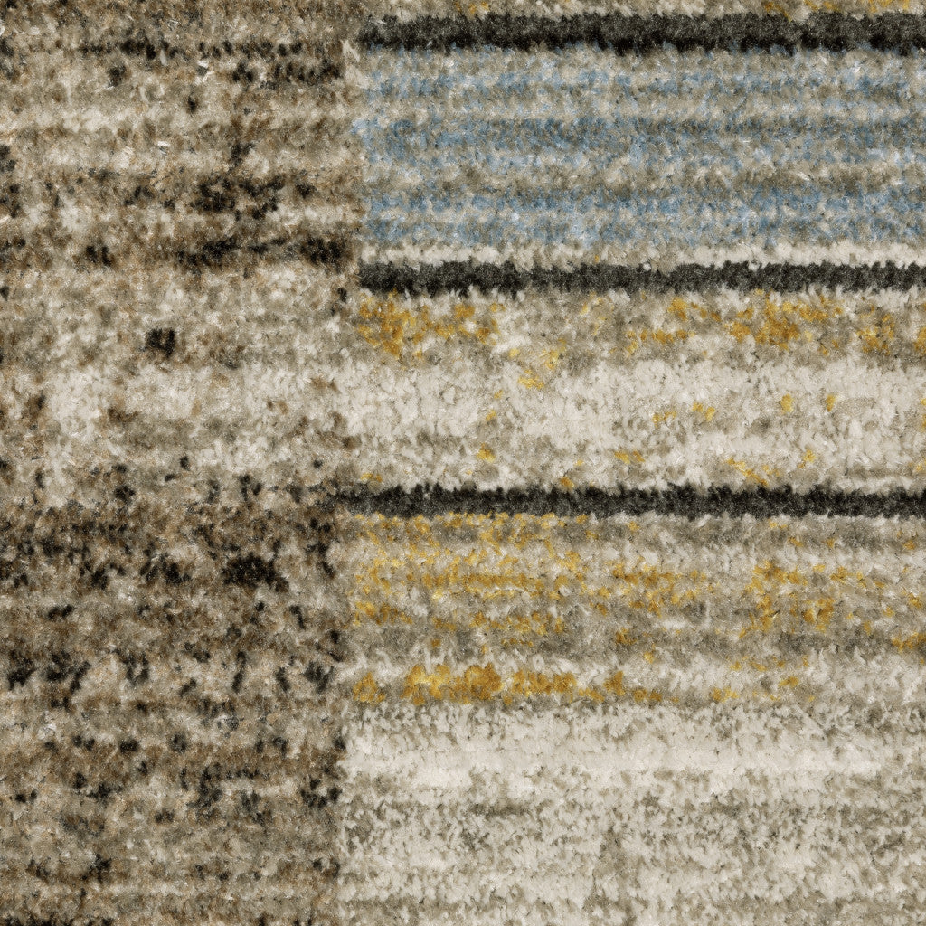 10' X 13' Beige Charcoal Brown Grey Tan Gold And Blue Geometric Power Loom Stain Resistant Area Rug With Fringe