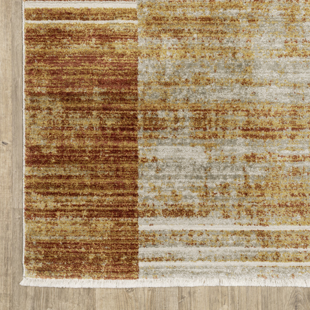 10' X 13' Rust Gold Blue Grey Ivory And Tan Geometric Power Loom Stain Resistant Area Rug With Fringe