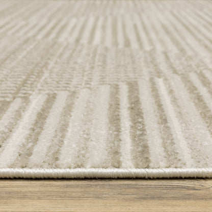 10' X 13' Ivory Beige Taupe And Tan Geometric Power Loom Stain Resistant Area Rug With Fringe