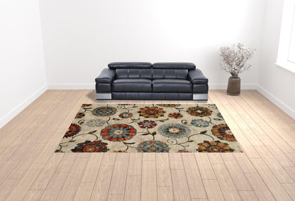 10' X 13' Ivory Blue Gold Green Orange Rust And Teal Floral Power Loom Stain Resistant Area Rug