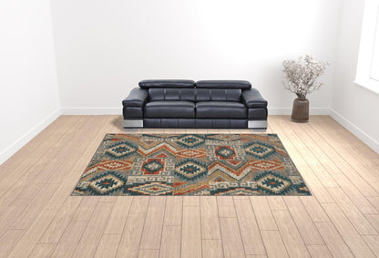 10' X 13' Blue Teal Grey Orange Gold Ivory And Rust Geometric Power Loom Stain Resistant Area Rug