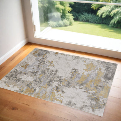 10' X 13' Ivory Gold And Gray Abstract Stain Resistant Area Rug