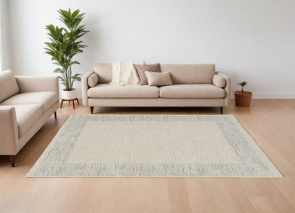 8' X 10' Ivory and Gray Abstract Power Loom Area Rug