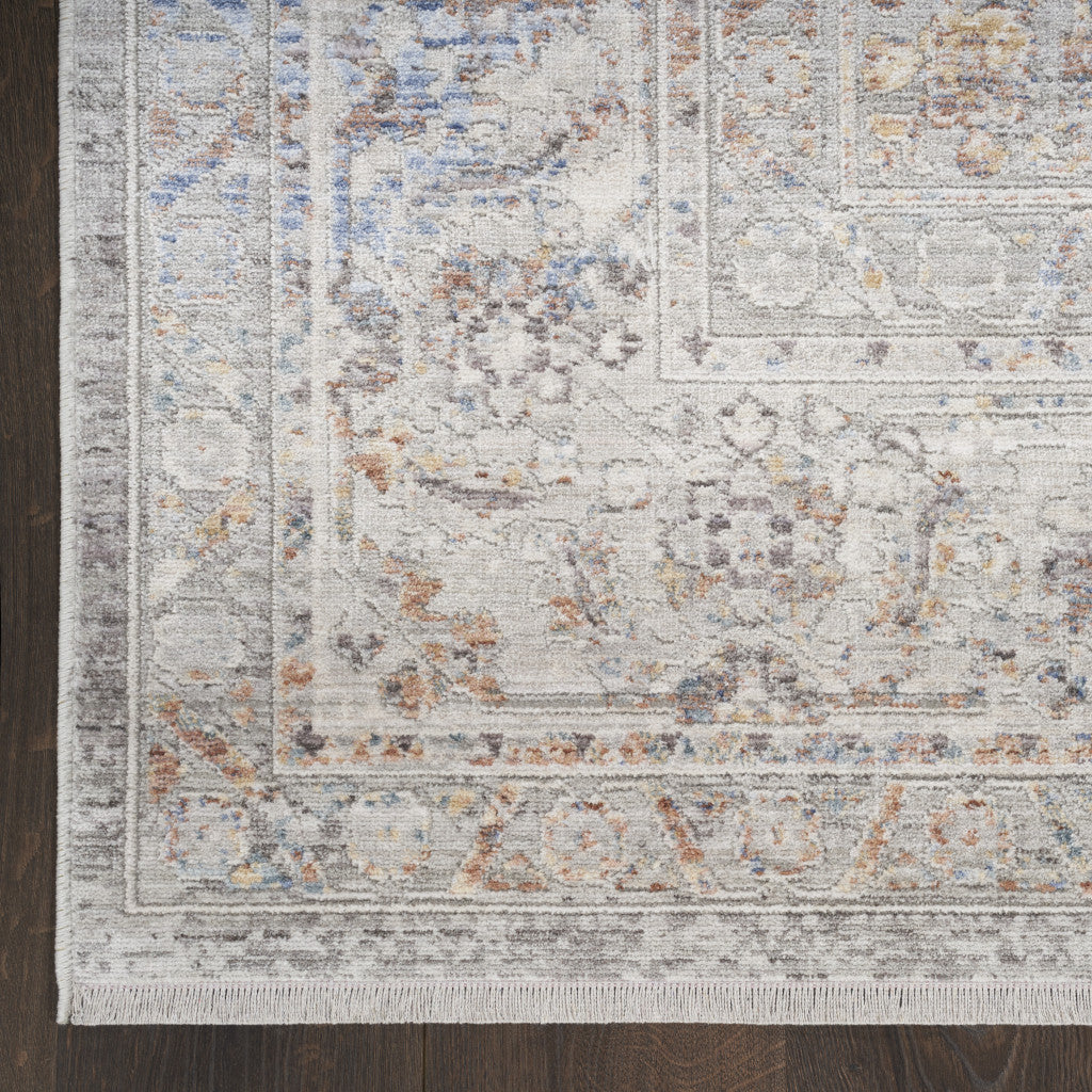 5' X 8' Ivory and Blue Oriental Power Loom Distressed Area Rug With Fringe