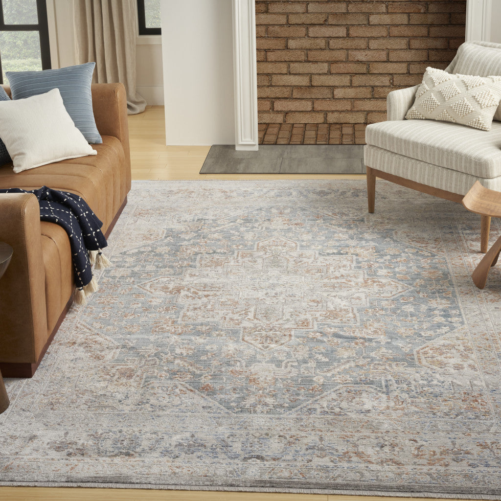 5' X 8' Ivory and Blue Oriental Power Loom Distressed Area Rug With Fringe